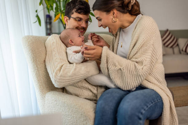 istock Smiling couple playing with baby boy 2075925592