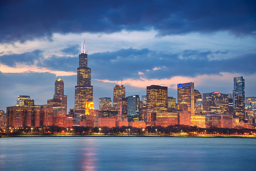 Cityscape image of famous Chicago skyline at beautiful spring sunset.