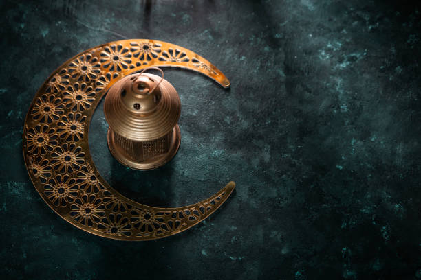 istock Eid Mubarak background golden colour lantern with crescent moon shape 2075927170