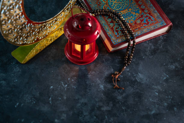 istock Islamic background, Quran with lantern and Tasbih on the table 2075928220