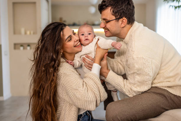 istock Happy young family at home 2075928759