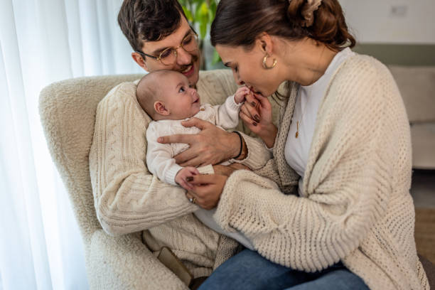 istock Happy young family at home 2075936195