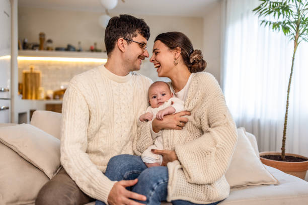 istock Happy young family at home 2075937262