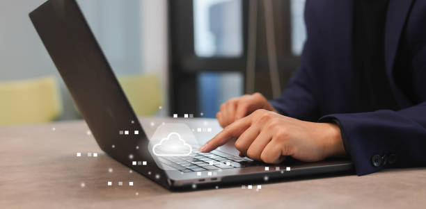 istock close up young man press synchronized button on laptop to upload  and download data from cloud computing with virtual network icon for futuristic technology and lifestyle concept 2075938318