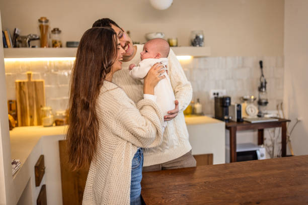 istock Happy young family at home 2075938855