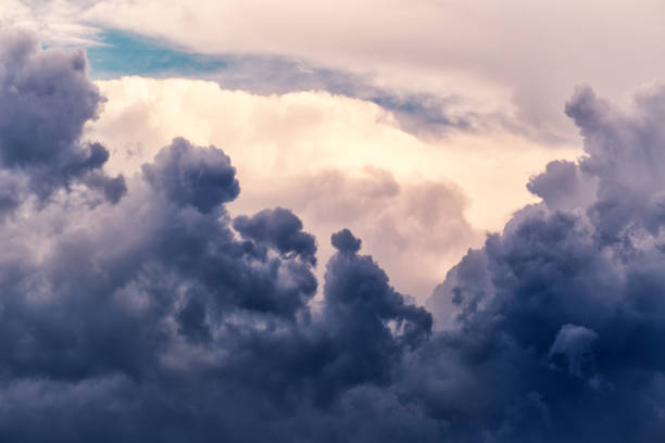 Light amid clouds in close-up, view of clouds from an airplane window