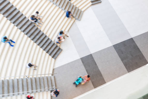 istock People relaxing on stairs 2075965434