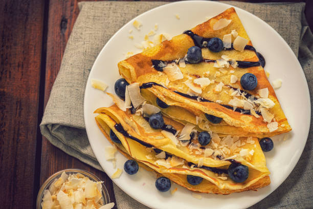 istock Crepes with blueberries, coconut flakes and chocolate sauce 2075986814