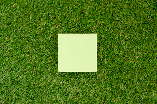 Top view of a product presentation scene with a pedestal set up on artificial grass lawn, creating a visually appealing and inviting display for marketing and advertising purposes.