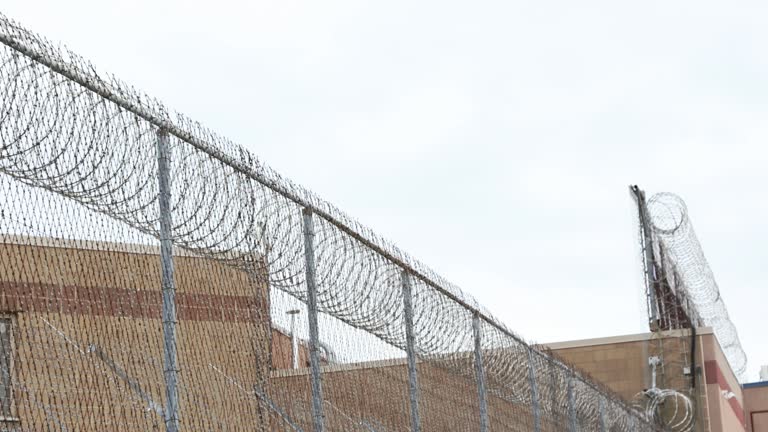 Razor wire along jail building