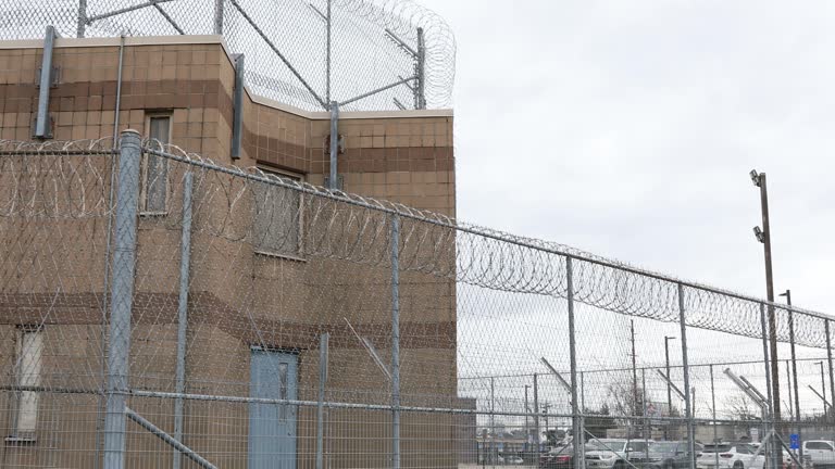 Razor wire continuously along jail building