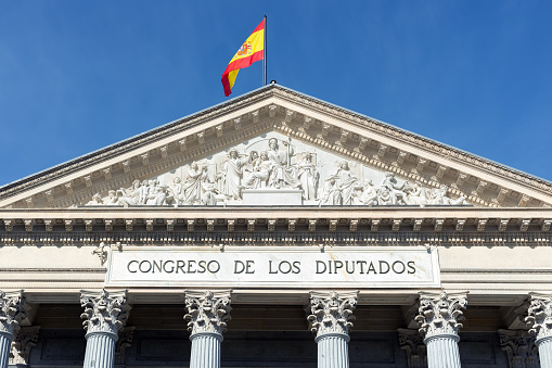 Madrid, Spain. Low-angle view of the main facade of the Congress of Deputies in Madrid.