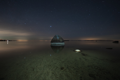 Night scene, seashore in Kaberneeme in spring under the starry sky. High quality photo