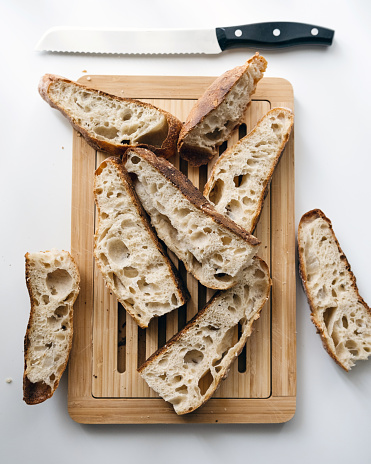 Freshly baked Homemade Artisan Sourdough Whole Wheat Bread on Cutting Board