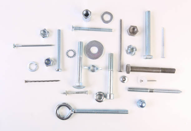 Metal fasteners bolts, screws, anchors, nuts, washers, nails on a white background