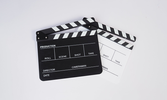 Two Clapper board or movie slate on white background.