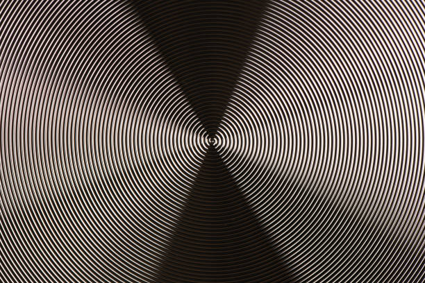 Black metal texture. Round metal texture. Metal texture background. Extrem close-up. High resolution photo. Full depth of field.
