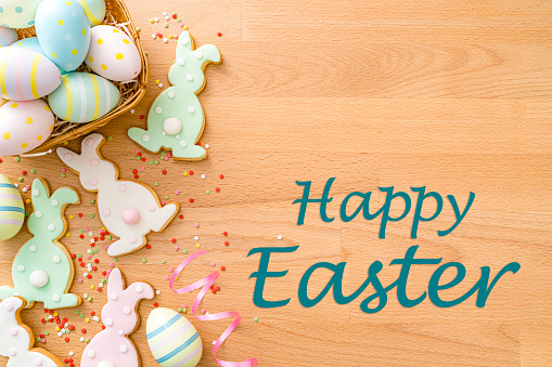 Happy Easter greeting card made of Esater Bunny cookies and Easter Eggs. High resolution 42Mp studio digital capture taken with SONY A7rII and Zeiss Batis 40mm F2.0 CF lens