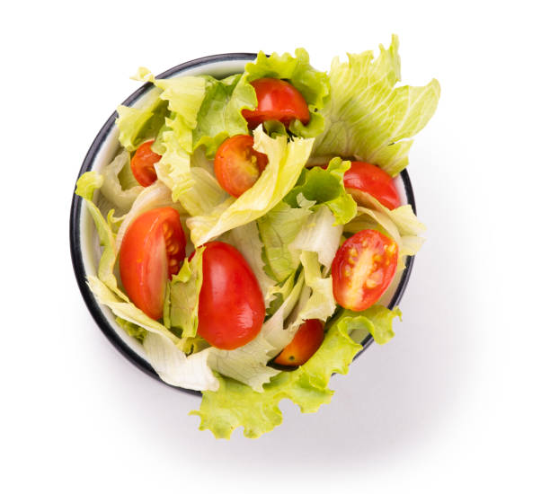 istock salad bowl with lettuce and cherry tomatoes top view isolated on white background 2076143921