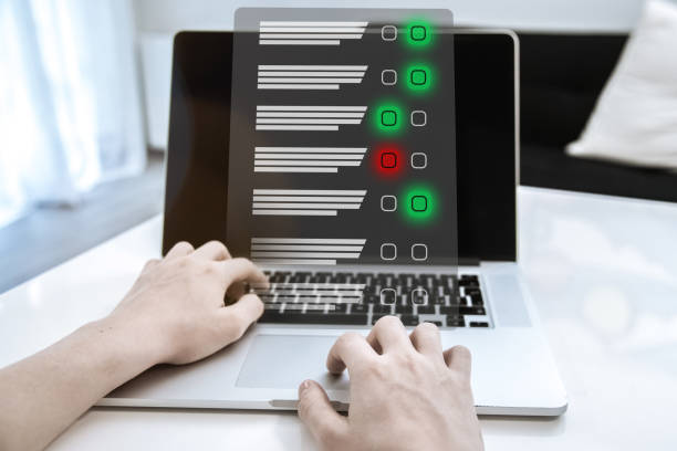 istock Man do online exam on virtual screen. Answer a survey filling out a tech form. Quiz, test concept 2076179393