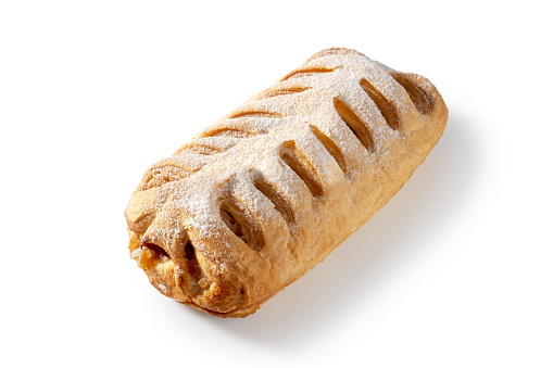 Indulge in the irresistible allure of homemade apple strudel with tender pastry layers and sweet cinnamon apple filling on a white background