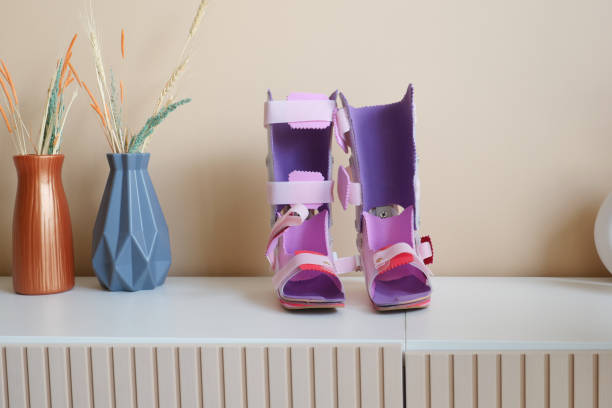 istock Child cerebral palsy disability legs orthosis on table 2076200658