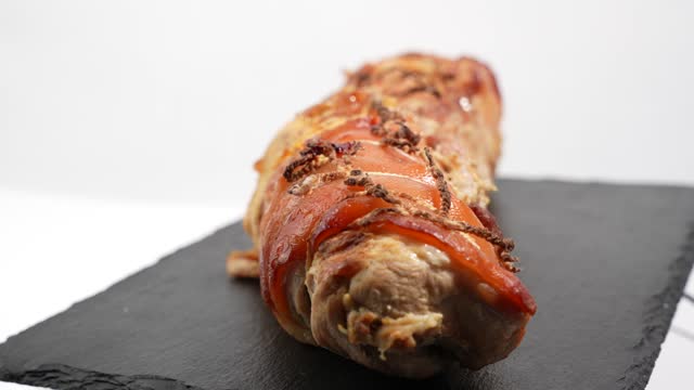 Baked pork, wrapped in a roll.