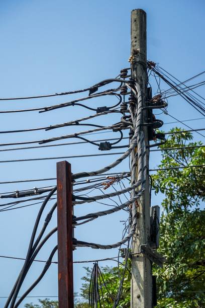 istock A power pole with many wires and cables hanging from it 2076230978