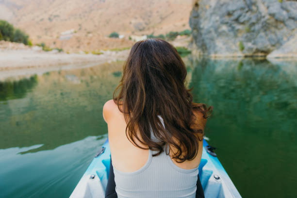 istock Woman Kayaking at Scenic Canyon During Sunset 2076232569