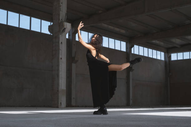 istock Young Female Dancer in a Black Dress 2076233653