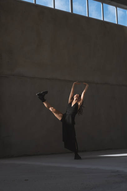 istock Young Female Dancer in a Black Dress 2076233657
