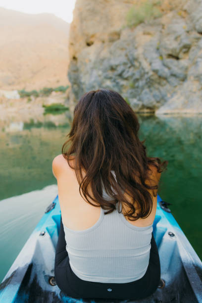 istock Woman Kayaking at Scenic Canyon During Sunset 2076235083