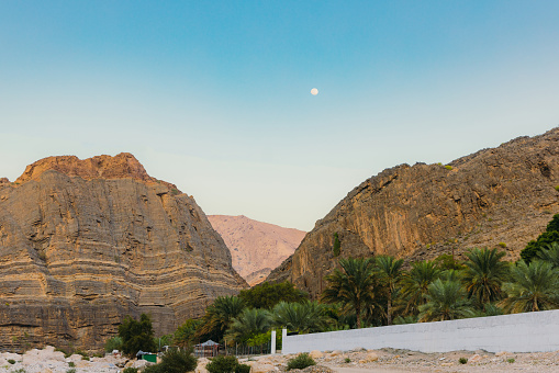 Scenic views of magnificent canyon with mountain river hidden in the mountains of Oman, Middle East