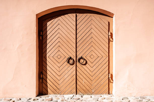 Superior, AZ: Blue and Brown Arched Door in White Wall