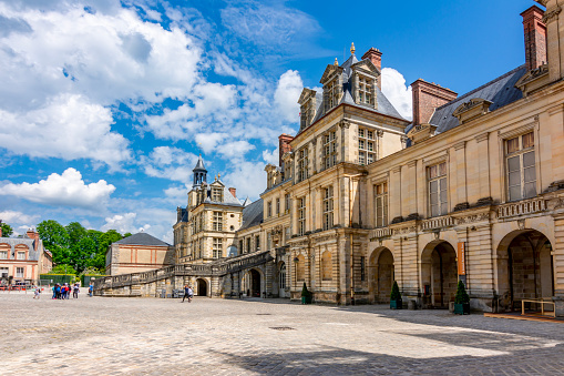 Fontainebleau, France - May 2019: Medieval Fontainebleau palace (Chateau de Fontainebleau) outside Paris