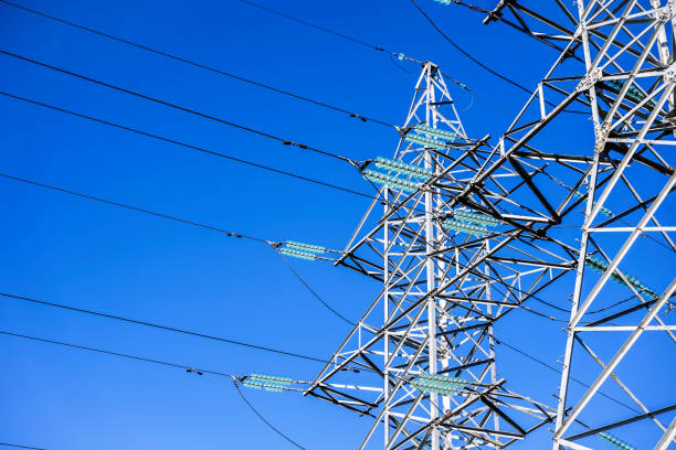 istock High voltage tower against the sky. Power transmission tower with wires 2076296923