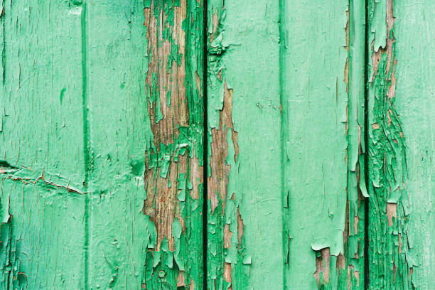 istock Old wooden planks with cracked peeling green paint. Painted texture background. Rustic background 2076321421