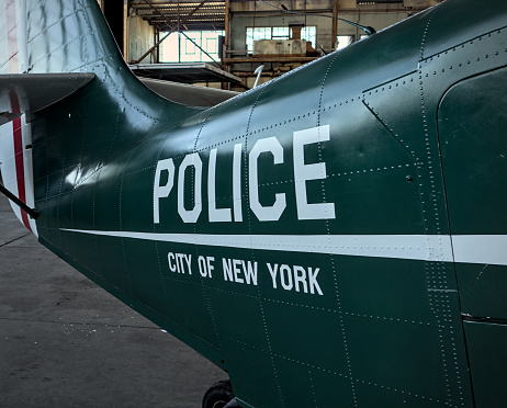 police city of new york sign on the side of vintage antique airplane body