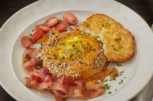 Copycat Air Fryer Everything  Bagel Egg in a Hole with Bacon, Cheddar Cheese and Crispy Hash Browns