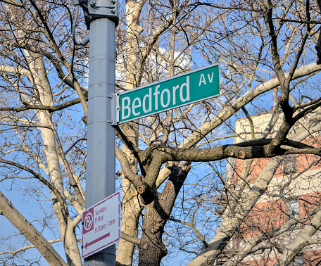 bedford avenue street sign on a lamp post street light in brooklyn new york city midwood neighborhood borough nyc