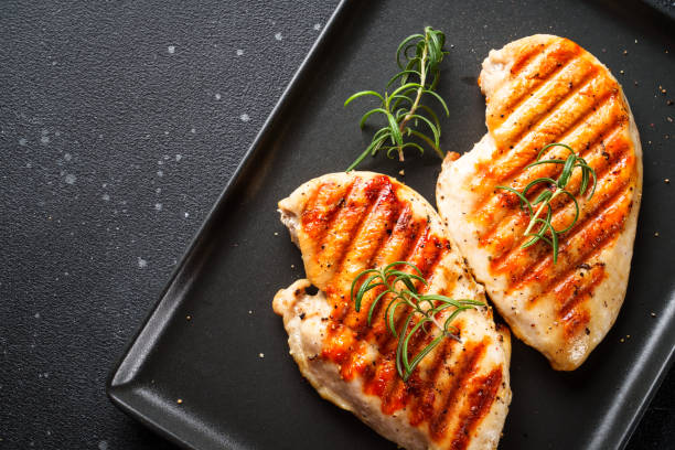 istock Chicken steak BBQ grill on black background. 2076382898