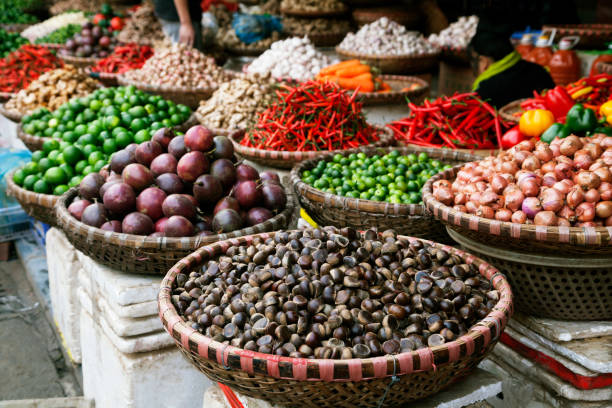 fruits and spices at a market in vietnam - lime market vietnam fruit 뉴스 사진 이미지