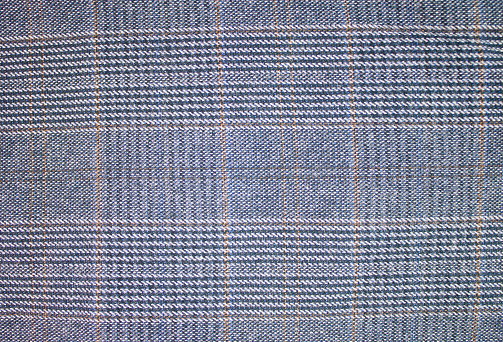 Fabric, material for sewing a suit. Checked textile fabric, background, texture.