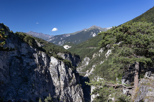 Beautiful summer view of the Arc Gorge and the Devils bridge (Pont du diable) near Modane in the Vanois National Park of Savoie in France.  Copy space above.