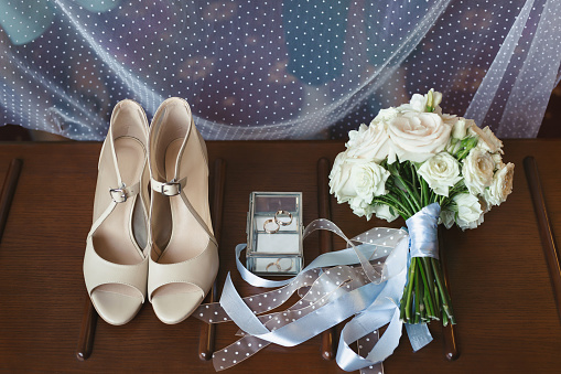 Elegant wedding accessories of the bride in the morning on the day of the celebration.