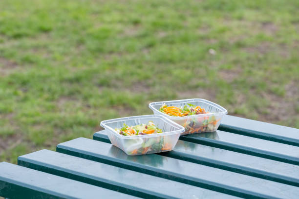 istock Plastic food containers with salads on picnic table 2076614453
