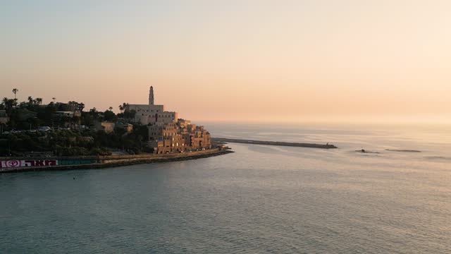 Aerial View Of Calm Marina Waters With St Peters Church In Background In Old Jaffa. Parallax Shot