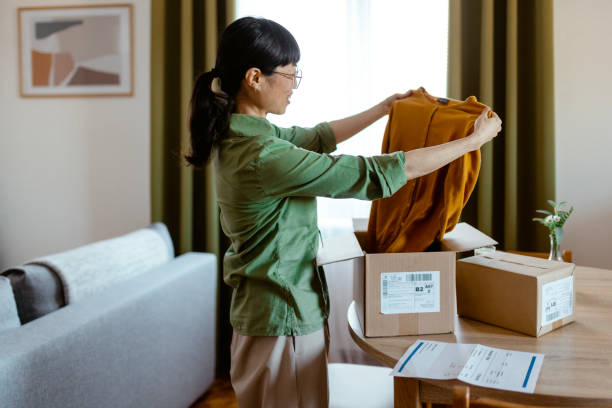 istock Female Customer Unpacking Carton Box 2076680490