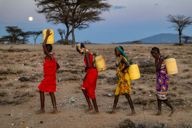 African children from Samburu tribe carrying water, Kenya, East Africa