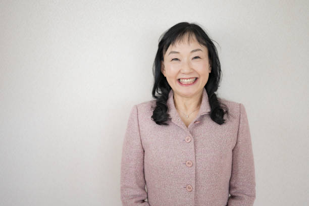istock Smile woman pink suit 2076740278